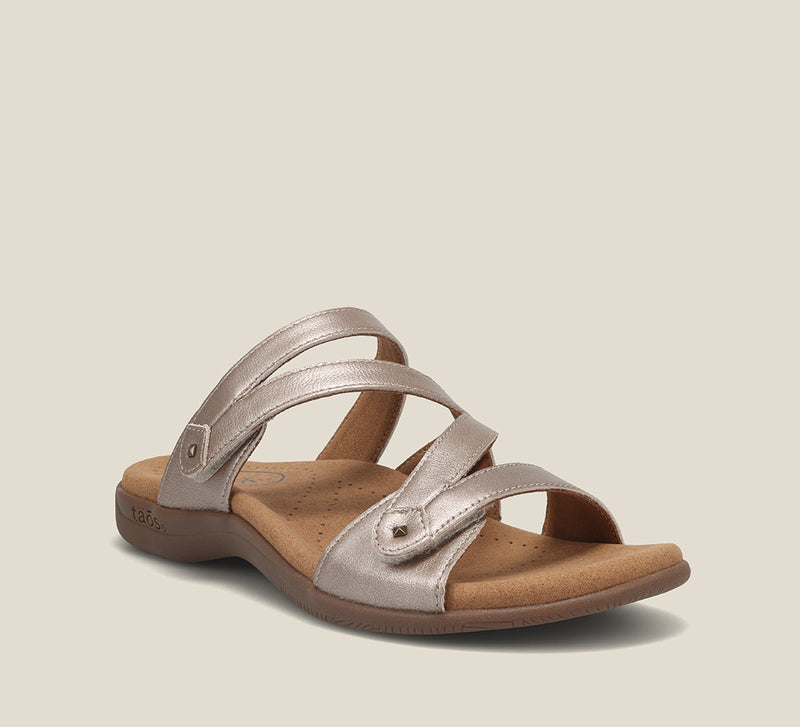 Double U, casual leather slide sandal with metal rivets, hook and loop straps, and a flexible, durable rubber outsole.