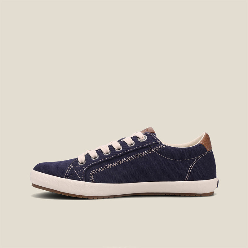 Outside Angle of Star Burst Navy/Tan Canvas sneaker withÃ‚Â fabricatedÃ‚Â leather trim,polyurethane removable footbed with rubber outsole 6