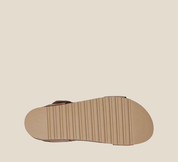 Outsole Angle of Luckie Caramel Casual leather sandal with pounded medallions hook and loop straps and cork- footbed.