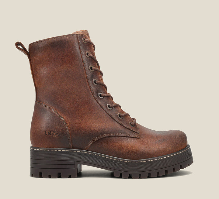 Instep image of Groupie Cognac Rugged boot with removable outsoles & an inside zipper lace-up adjustability.