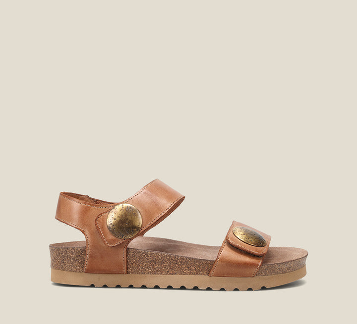 Side Angle of Luckie Caramel Casual leather sandal with pounded medallions hook and loop straps and cork- footbed.