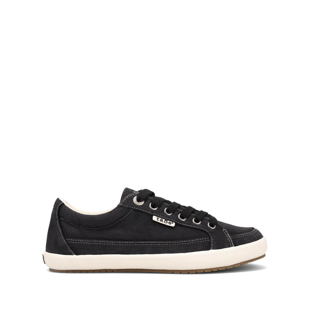 Side angle image of Taos Footwear Moc Star 2 Black Distressed Size 7.5