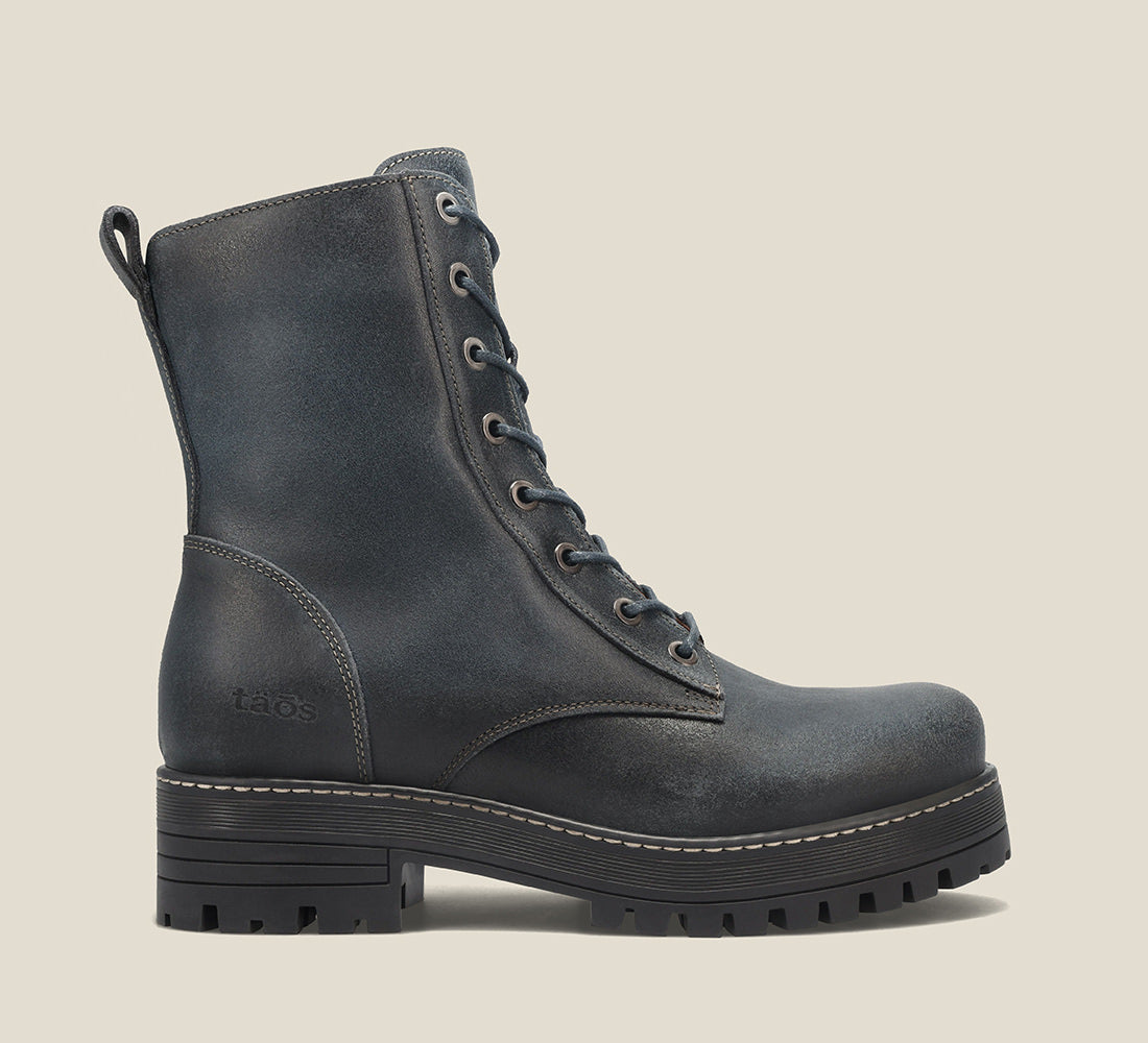 Instep image of Groupie Dark Blue Rugged boot with removable outsoles & an inside zipper lace-up adjustability.