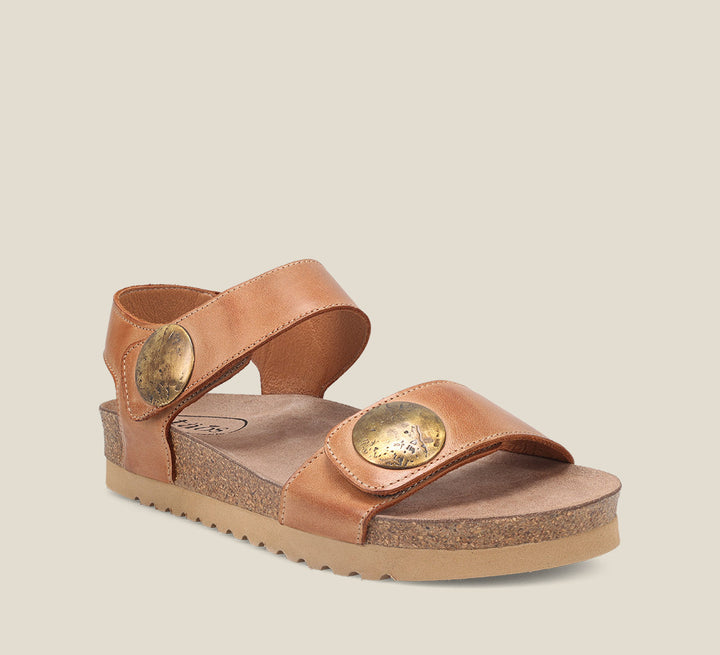3/4 Angle of Luckie Caramel Casual leather sandal with pounded medallions hook and loop straps and cork- footbed.