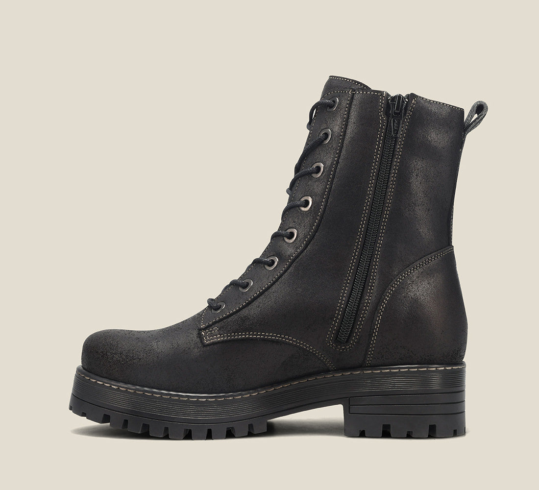 Outsole image of Groupie Black Rugged boot with removable outsoles & an inside zipper lace-up adjustability.