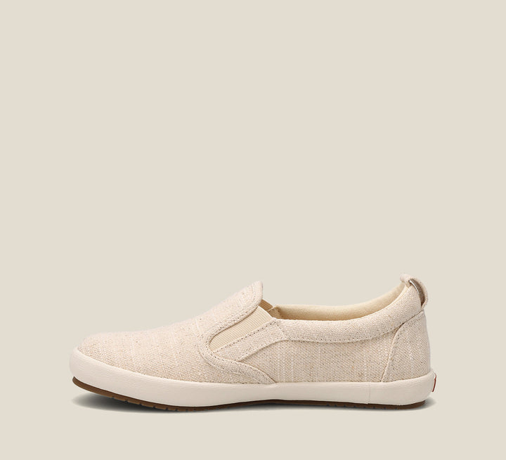 Side image of Dandy Natural Hemp slip on sneaker featuring hemp upper material and removable footbed with rubber outsole.