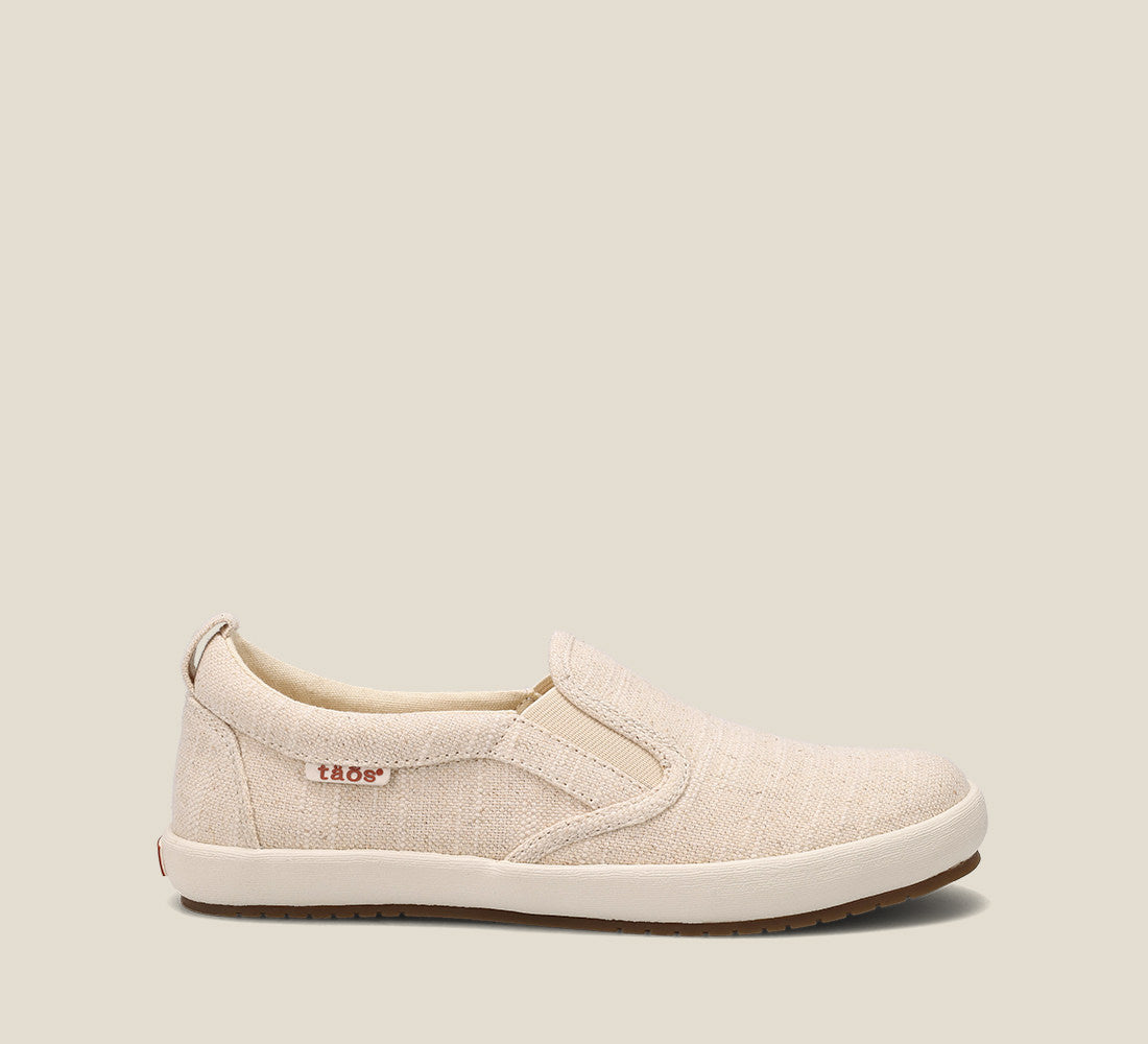 Instep image of Dandy Natural Hemp slip on sneaker featuring hemp upper material and removable footbed with rubber outsole.