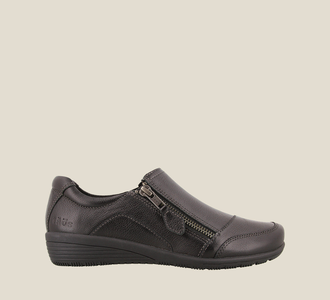 Outside Angle of Character Black Leather shoe with an outside microfiber lining, curves & pods removable footbed, & rubber outsole - size 6