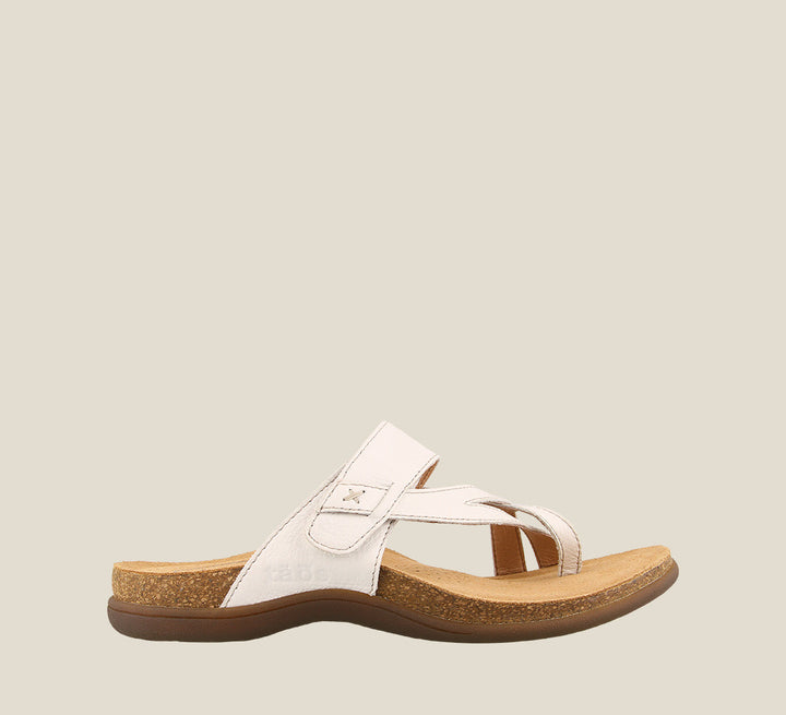 Outside angle of Perfect White Slide sandal on our cork footbed featuring an adjustable strap and rubber outsole. - size 6
