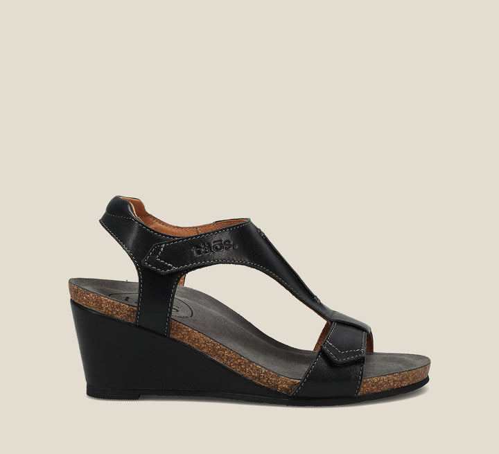 Outside angle of Sheila 2 Black Wedge Sandal featuring two adjustable hook and loops and rubber outsole. - size 39