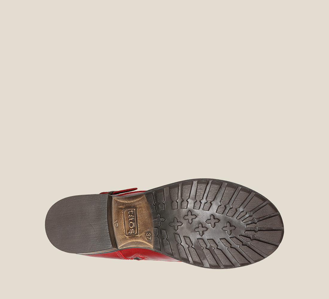 Outsole image of Crave Red Leather &  boot with buckle & an inside zipper lace-up adjustability.