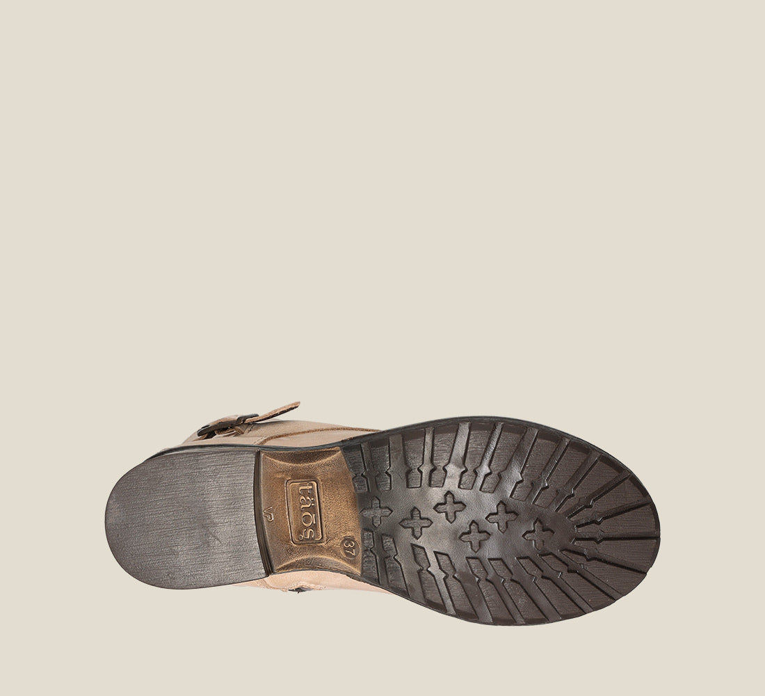 Outsole image of Crave Stone Leather &  boot with buckle & an inside zipper lace-up adjustability.