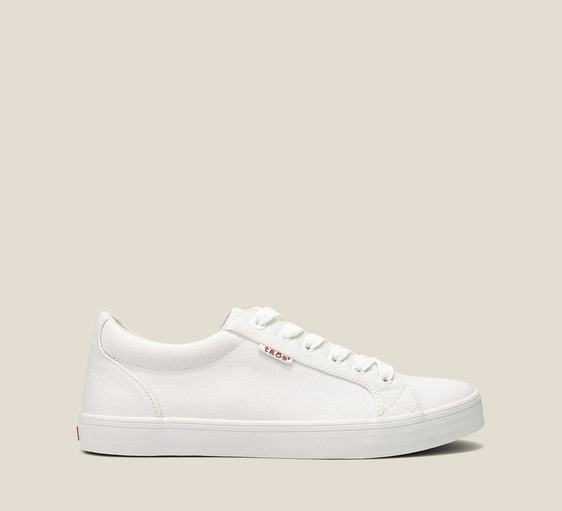 Outside angle of Starsky White Canvas Men's canvas lace up sneaker featuring a Curves & Pods removable footbed with Soft Support and rubber outsole.